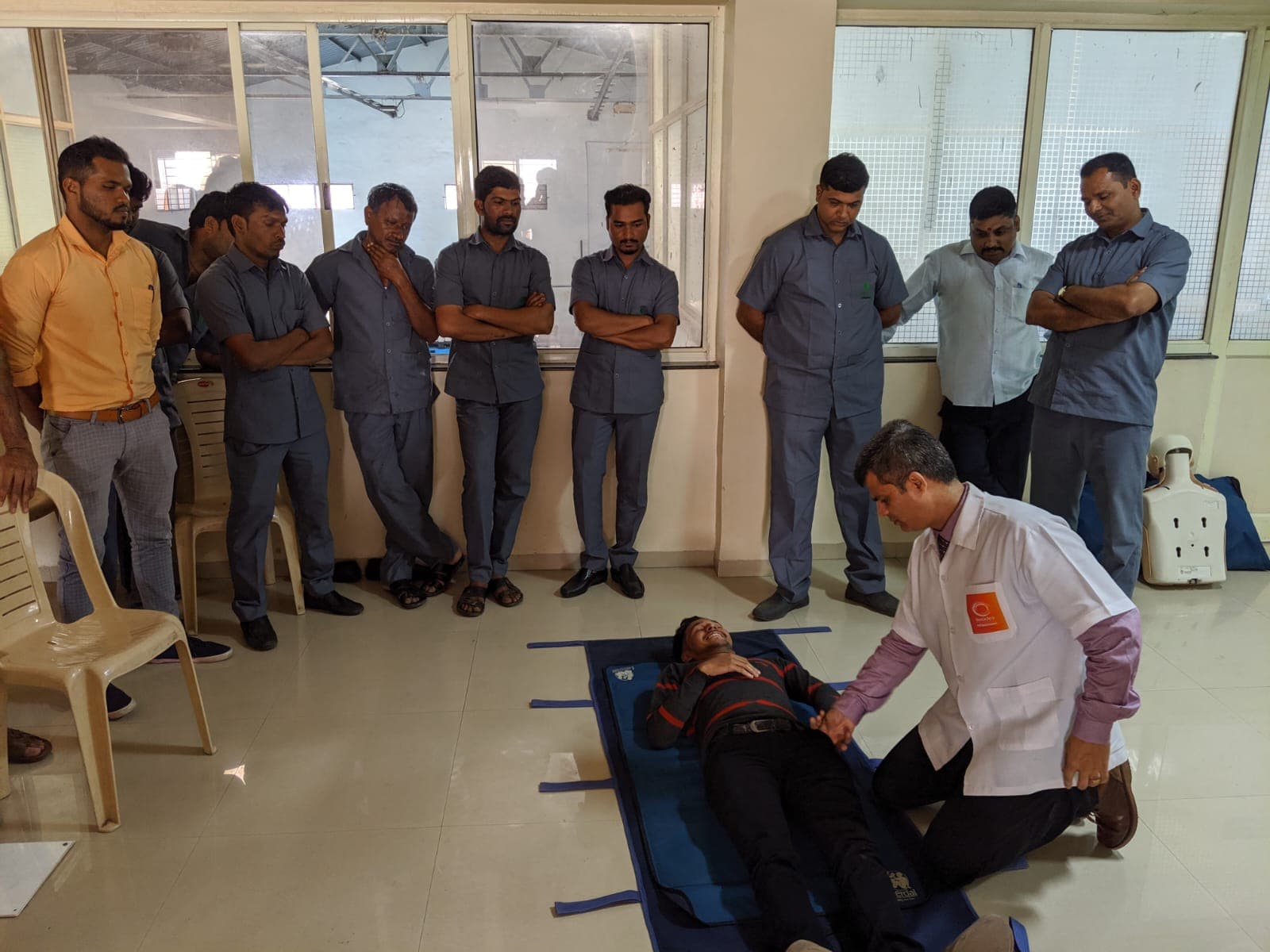 First aid practical — pulse checking on training mat